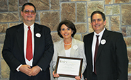 Teresa Marks, center, with two representatives of Jonesboro FritoLay