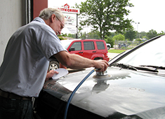 Worker at an auto collision repair shop